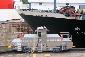 Japanese built tugs help pull ships through the locks at Mira Flores.